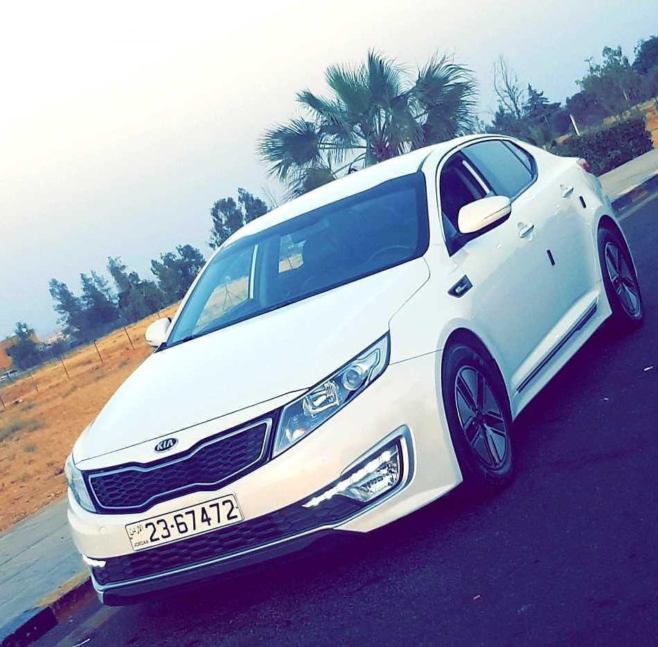 KIA K5 2013 فحص كامل تأمين شامل ماتور 2000cc جلد كشافات جنط بصمة شاشة مع كاميرا خلفية حساسات تلفون BLUETOOTH CD AUX USB IPOD NAVIGATION اضاءة AUTO اضاءة LED مكيف حامي بارد 100% تدفئة ك...