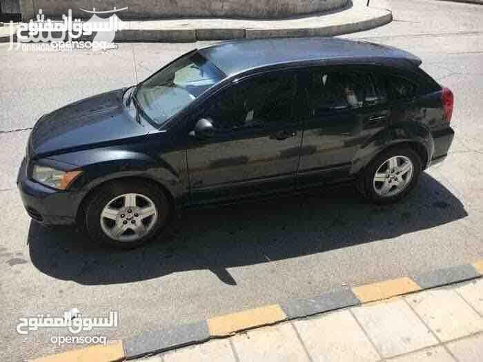 دودج كالبر الفحص 4 جيد ماتور 2000 سي سي جير اوتوماتيك لون فيراني مميز وضع السيارة توب نظافة صيانة كاملة من زيوت فلاتر بركات بواجي هيئة امامية خلفيو من صنوبرصات و كفات و عمدان توازن و جلود (لا...